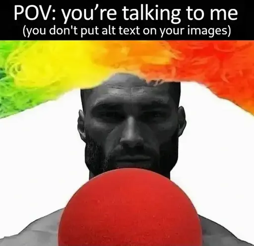 A POV shot of someone looking at muscular man framed by a clown wig and nose. Caption: POV: you're talking to me (you don't put alt text on your images).